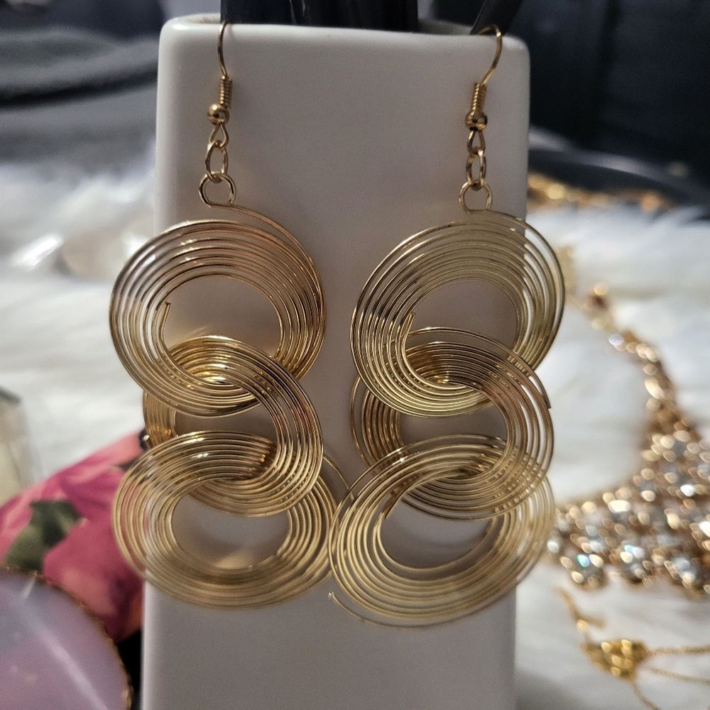 Spiral gold tone drop earrings
